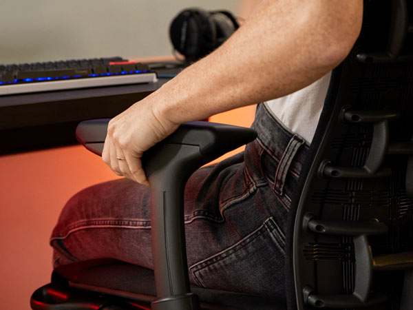 Close up of Dr Lindsey Migliore adjusting arm on Embody gaming chair