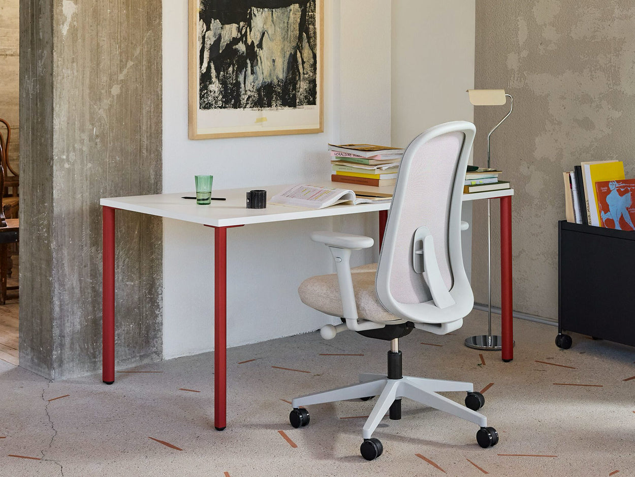 A bright home office featuring a Herman Miller Lino ergonomic chair and OE1 desk.