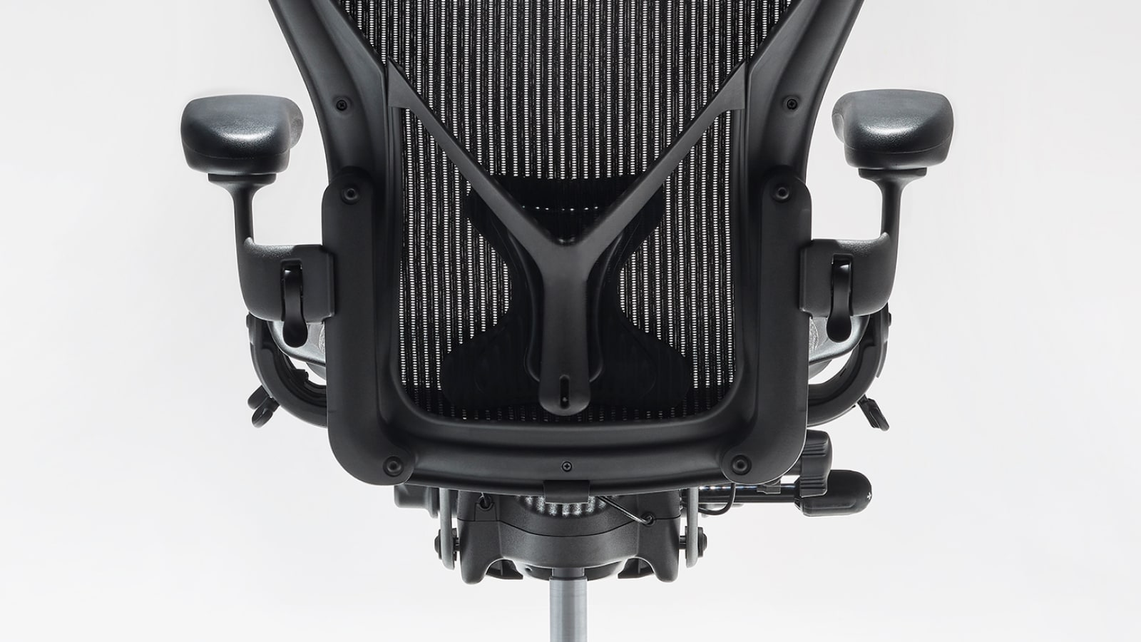 Close photograph of showing detailed rear view of back support of the Aeron home office chair