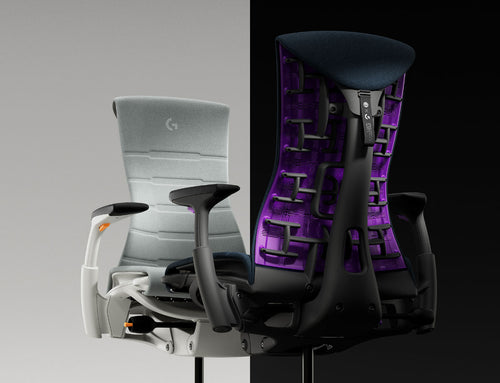 Two Herman Miller Embody Gaming Chairs facing each other in orange grey Ignite and purple blue Nova colours.