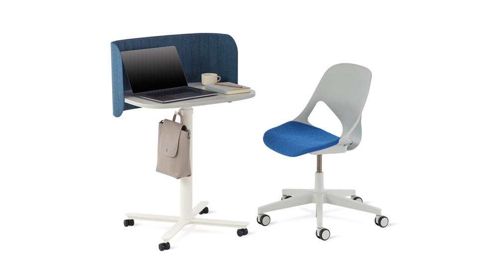 Herman Miller's Passport desk featuring fabric screen and bag hook, next to a Herman Miller Zeph chair in white and blue.