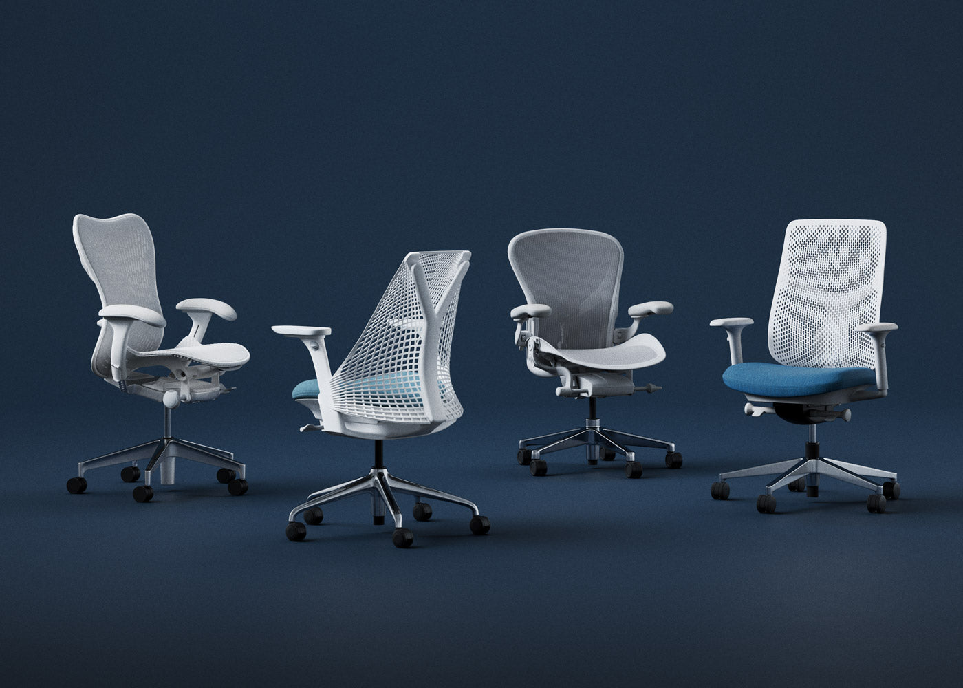 A lineup of four white Herman Miller ergonomic office chairs against a navy blue back drop.